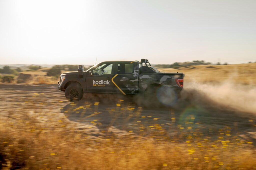 The Ford F-150 is driving down a dirt road in the latest synthetic television report.
